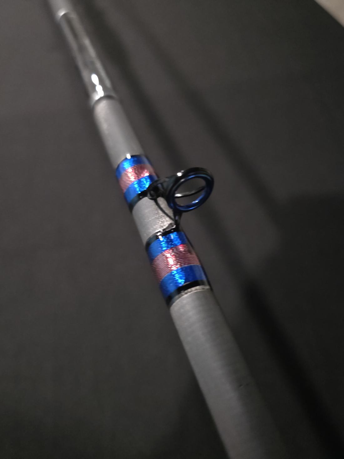 Blue wrapped guide on a custom rod